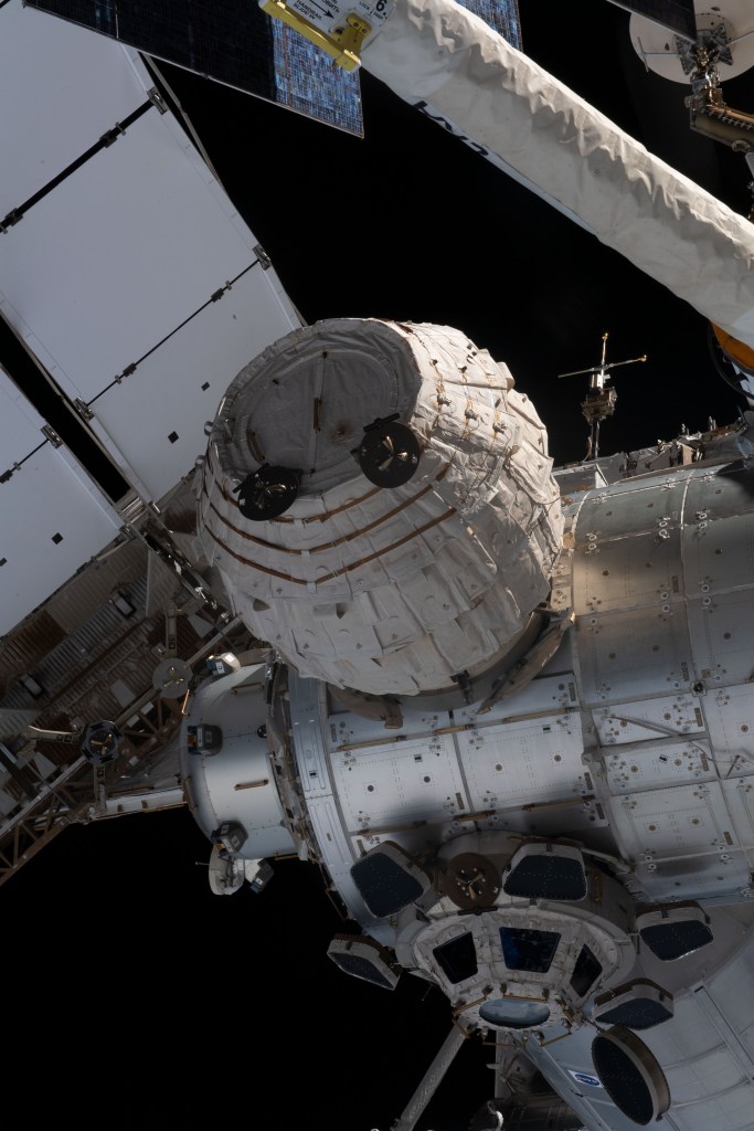 iss068e055469 (Feb. 19, 2023) --- BEAM (center foreground), the Bigelow Expandable Activity Module, including the seven-window cupola (bottom), with its covers open, are pictured attached to the International Space Station's Tranquility module.