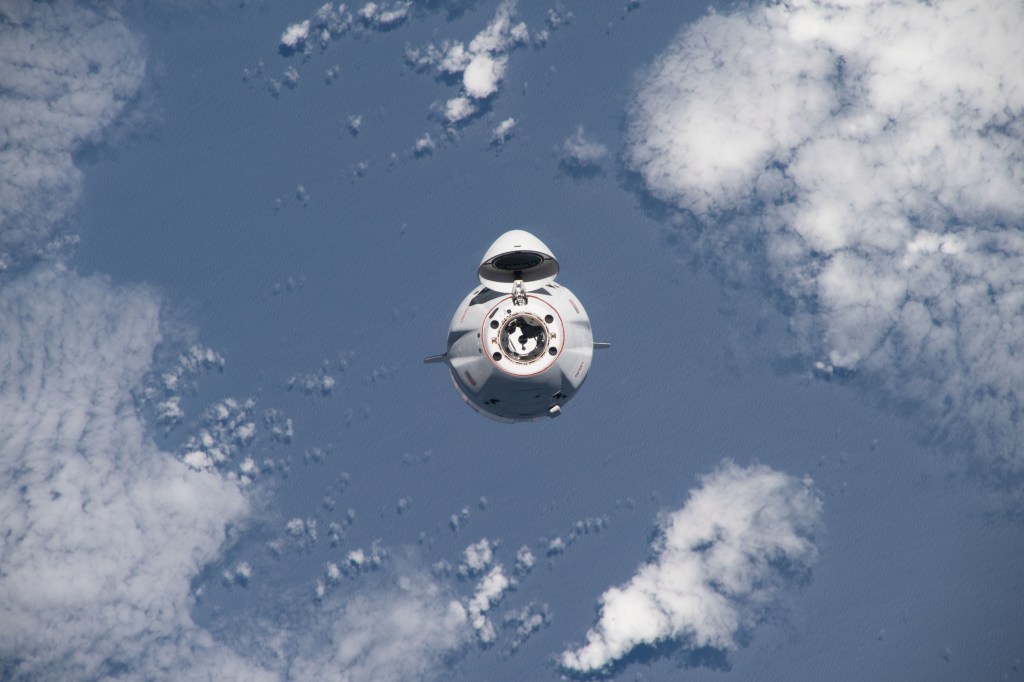 iss068e025141 (Nov. 27, 2022) --- The SpaceX Dragon cargo craft, loaded with over 7,700 pounds of science, supplies, and cargo, approaches the International Space Station for a docking 264 miles above the Atlantic ocean in between South America and Africa.