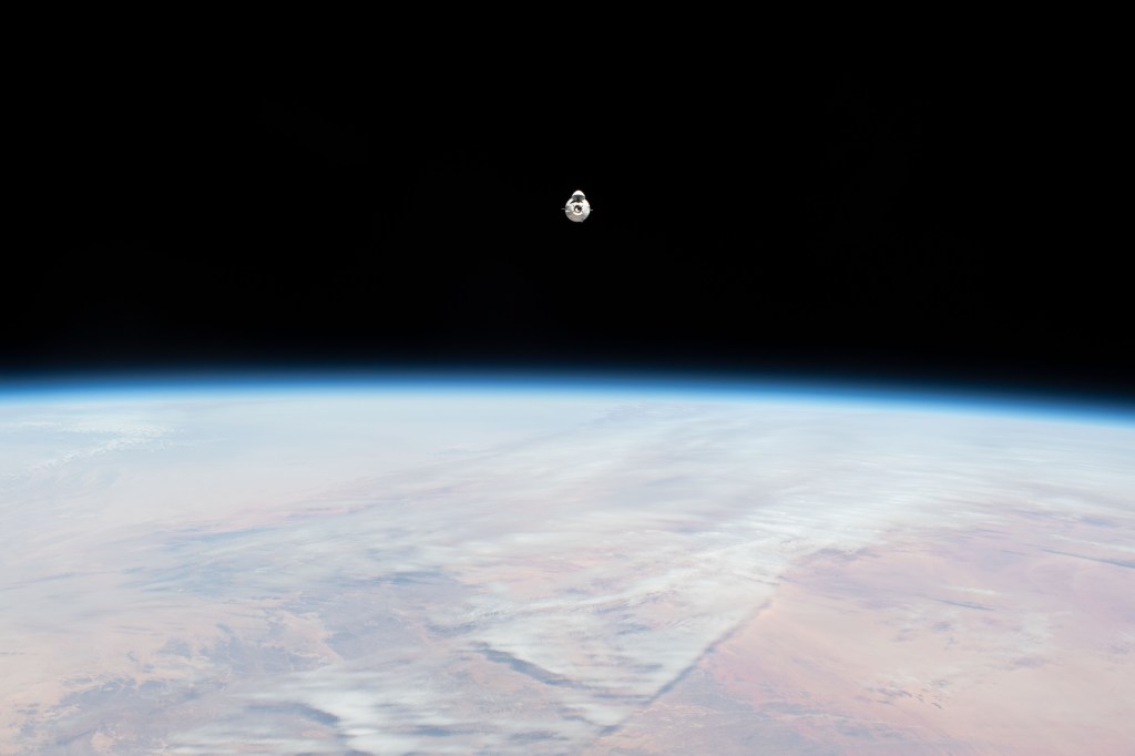 iss068e025158 (Nov. 27, 2022) --- The SpaceX Dragon cargo craft, loaded with over 7,700 pounds of science, supplies, and cargo, approaches the International Space Station while orbiting 259 miles above the African continent.
