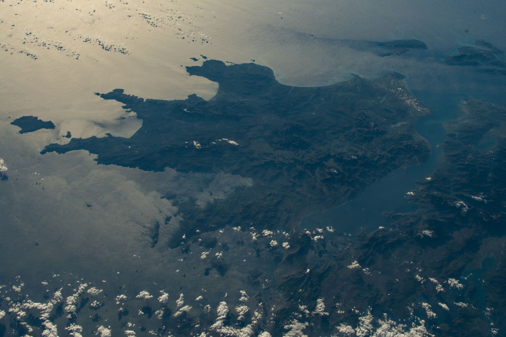 iss068e024146 (Nov. 23, 2022) --- The sun's glint beams across the Mediterranean, Ionian, and Myrtoan Seas highlighting southern Greece in this photograph from the International Space Station as it orbited 259 miles above the Aegean Sea off the coast of Turkey.