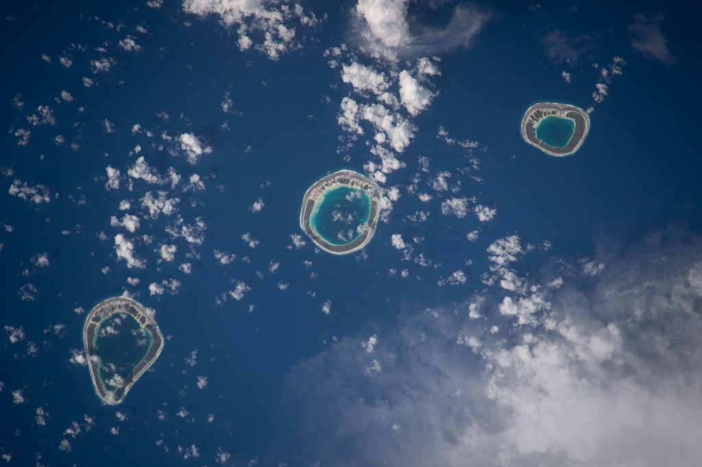iss068e043869 (Jan. 30, 2023) --- The uninhabited atolls of (from left) Vahanga, Tenarungo, and Tenanaro, which are part of French Polynesia in the south Pacific Ocean, are pictured from the International Space Station as it orbited 260 miles above.