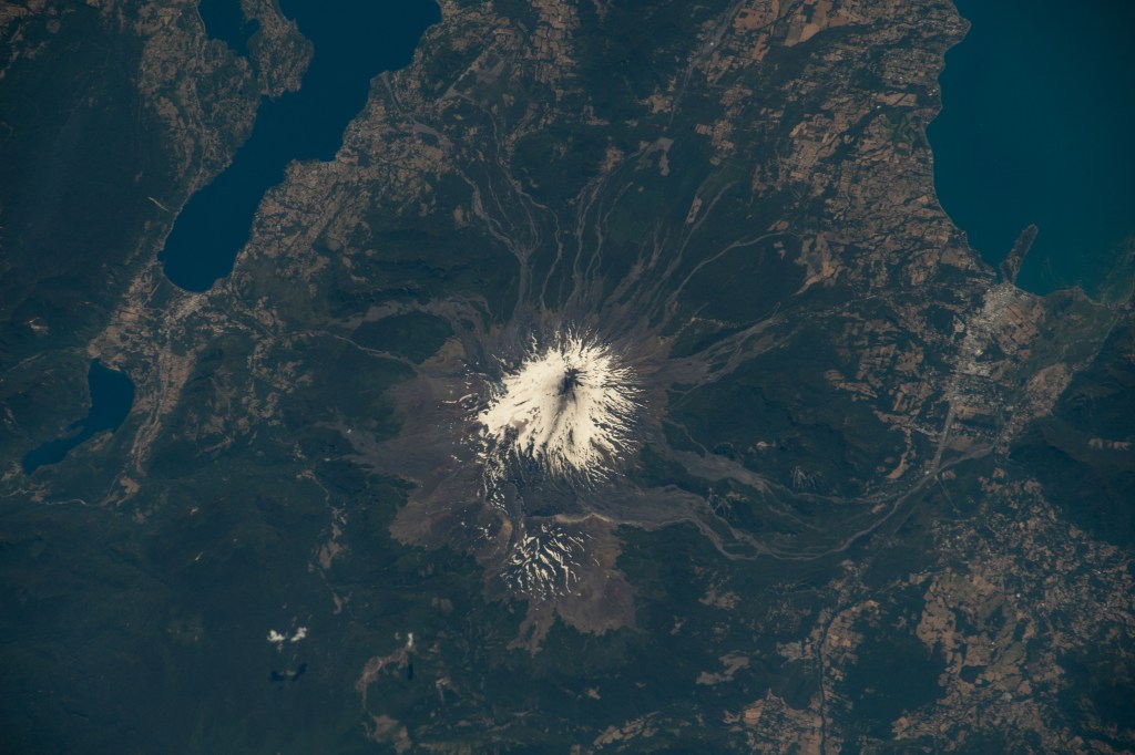 iss068e040597 (Jan. 17, 2023) --- Villarica Volcano, one of the most active volcanoes in Chile, is pictured from the International Space Station as it orbited 264 miles above the Andes mountain range on the South American continent.