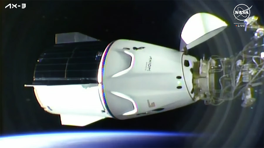 The SpaceX Dragon Freedom spacecraft carrying four Axiom MIssion 3 astronauts is pictured docked to the space station shortly after an orbital sunrise. Credit: NASA TV