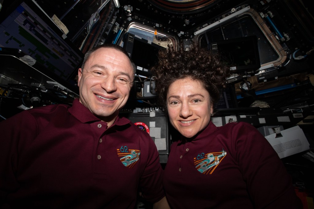 iss062e085457 (March 9, 2020) --- NASA astronauts and Expedition 62 Flight Engineers Andrew Morgan and Jessica Meir are pictured inside the cupola, the International Space Station's "window to the world," shortly after capturing the SpaceX Dragon resupply ship.