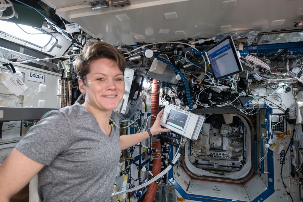 NASA astronaut Anne McClain is pictured exercising aboard the International Space Station inside the U.S. Destiny laboratory module.