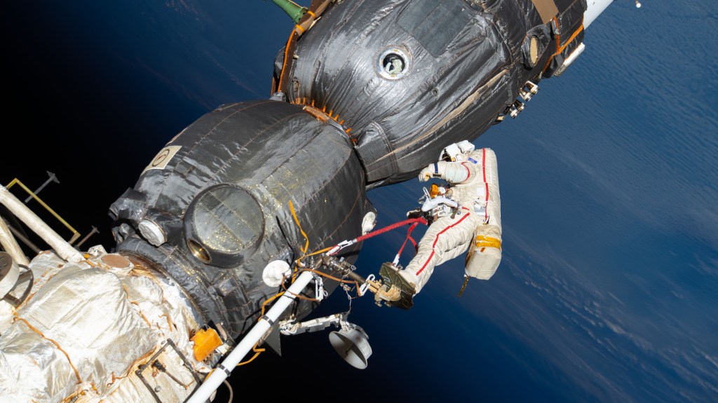 Russian spacewalker Oleg Kononenko (suit with red stripes) works outside the International Space Station over 250 miles above Earth to inspect the Soyuz MS-09 spacecraft. During the spacewalk, he and fellow spacewalker Sergey Prokopyev (out of frame) examined the external hull of the Soyuz crew ship docked to the Rassvet module. The area corresponded with the location of a small hole inside the Soyuz habitation module that was found in August and caused a decrease in the space station’s pressure. The hole was fixed internally with a sealant within hours of its detection. During the spacewalk, Kononenko and Prokopyev collected samples of some of the sealant that extruded through hole to the outer hull before heading back inside the Pirs docking compartment and closing the hatch completing a seven-hour, 45-minute spacewalk.