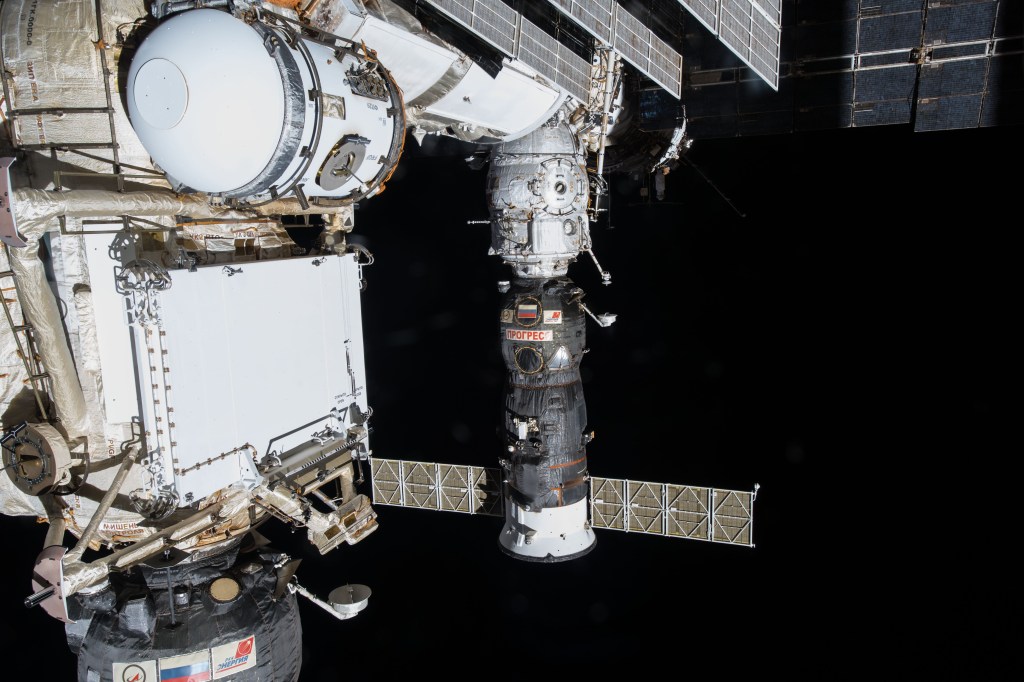 Russia's Progress 68 resupply ship is pictured docked to the Poisk docking compartment a few days before it completed its cargo mission and undocked on March 28, 2018 for a month of orbital engineering tests.