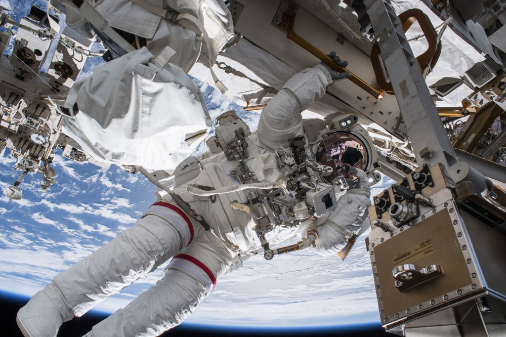 NASA astronaut Drew Feustel seemingly hangs off the International Space Station while conducting a spacewalk with fellow NASA astronaut Ricky Arnold (out of frame) on March 29, 2018. Feustel, as are all spacewalkers, was safely tethered at all times to the space station during the six-hour, ten-minute spacewalk.