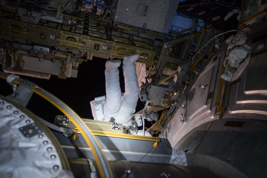 NASA astronaut Ricky Arnold is seen inside his Extravehicular Mobility Unit (EMU), or spacesuit, outside the U.S. Quest airlock during a spacewalk he conducted with fellow NASA astronaut Drew Feustel (out of frame) March 29, 2018.