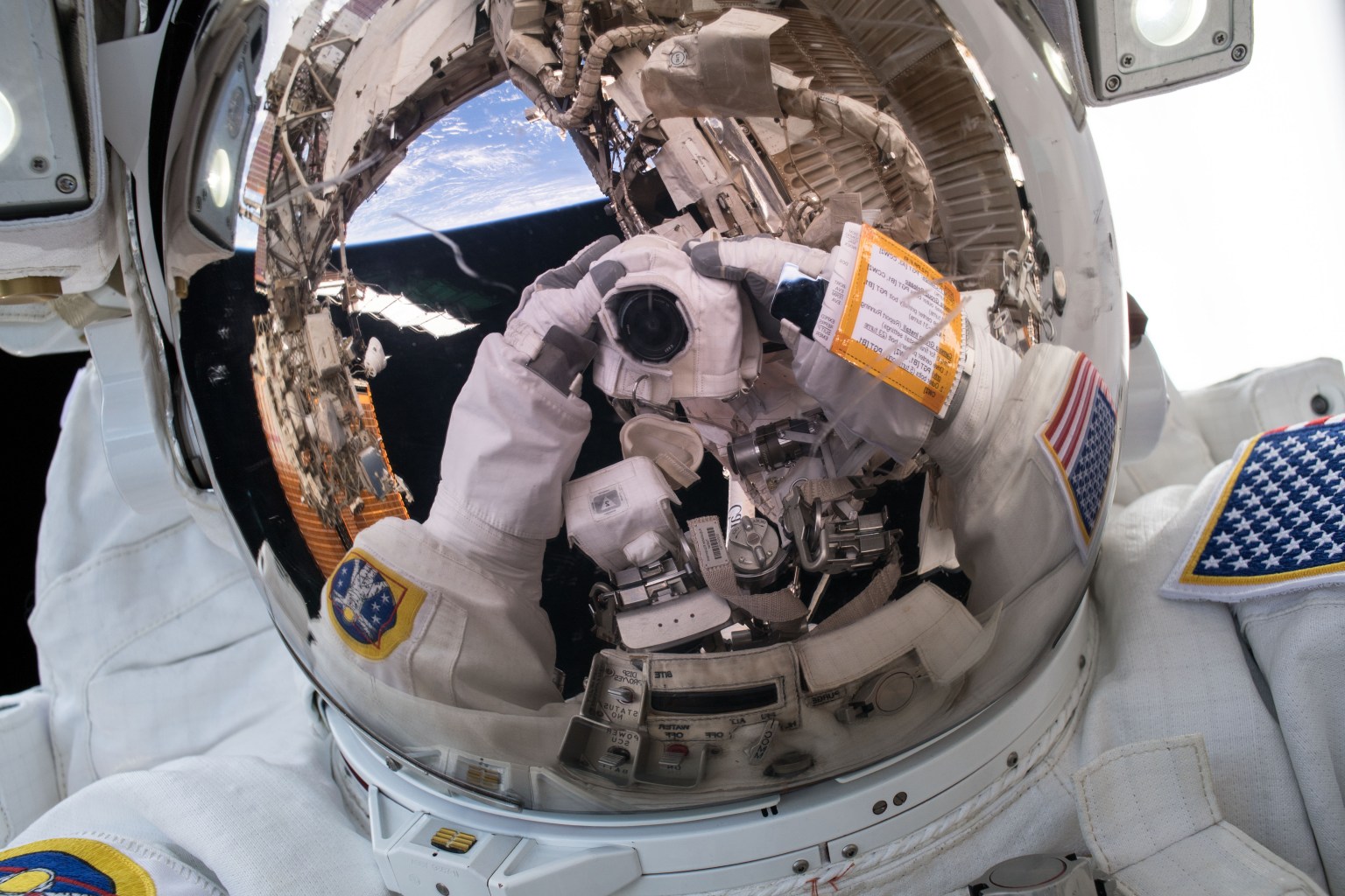 NASA astronaut Ricky Arnold takes an out of this world "space-selfie" during a brief opportunity while conducting a spacewalk with fellow NASA astronaut Drew Feustel (out of frame) on March 29, 2018.