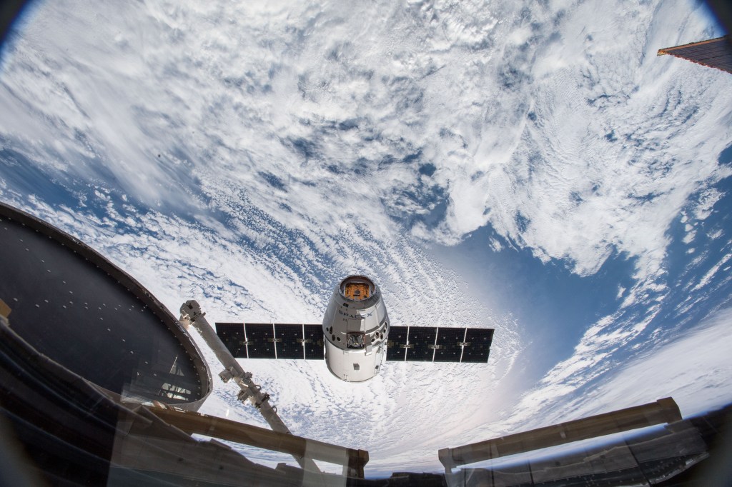 The SpaceX Dragon resupply ship nears its capture point about 10 meters away from the International Space Station. Japanese astronaut Norishige Kanai commanded the Canadian Space Agency's Canadarm2 robotic arm to grapple Dragon at 6:40 a.m. EDT over the southern part of the Democratic Republic of the Congo in Africa. NASA astronaut Scott Tingle backed up Kanai while monitoring the cargo ship's approach and rendezvous.
