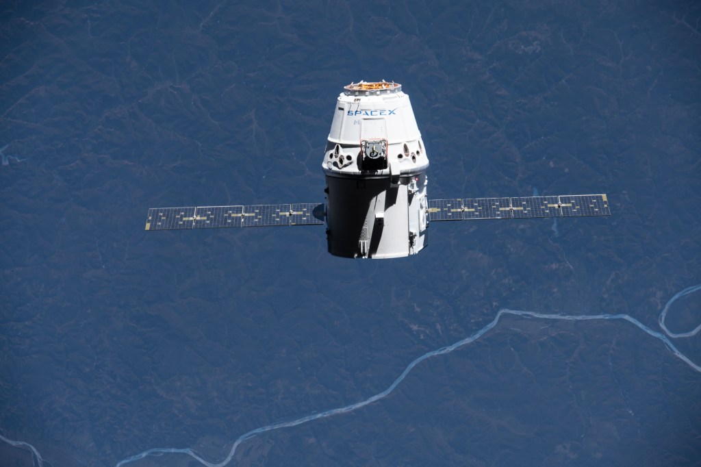 The SpaceX Dragon resupply ship slowly approaches the International Space Station as the two spacecraft orbit over north-eastern China near the Mongolian and Russian borders.