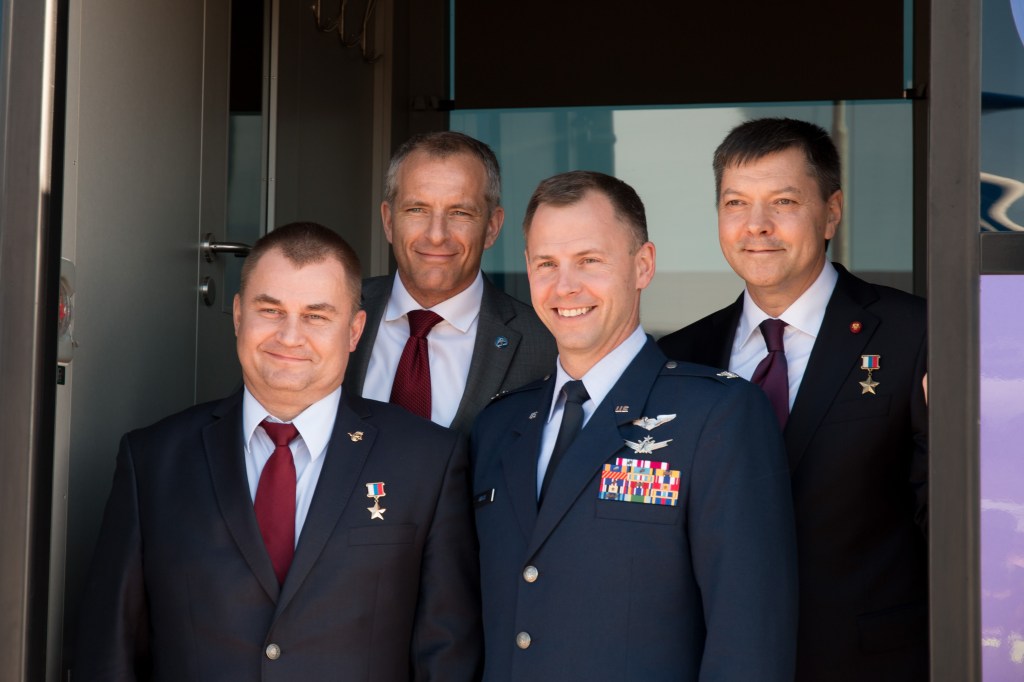 The Expedition 57 prime and backup crew members pose for pictures Sept. 25 after arriving at their launch site in Baikonur, Kazakhstan for final pre-launch training. In the front row are the prime crew members, Alexey Ovchinin of Roscosmos (left) and Nick Hague of NASA (right), and in the back row are the backup crew members, David Saint-Jacques of the Canadian Space Agency (back row, left) and Oleg Kononenko of Roscosmos (back row, right). Hague and Ovchinin will launch Oct. 11 from the Baikonur Cosmodrome in Kazakhstan on the Soyuz MS-10 spacecraft for a six-month mission on the International Space Station.