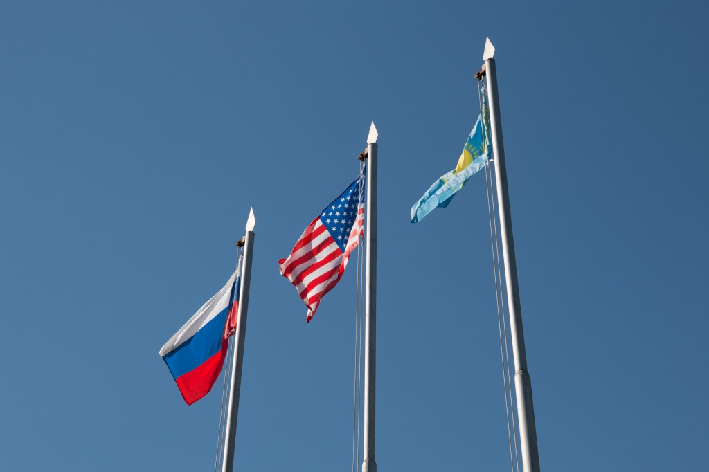 jsc2018e084636 (Sept. 27, 2018) --- The flags of Russia, the United States and Kazakhstan fly high Sept. 27 at the Cosmonaut Hotel crew quarters in Baikonur, Kazakhstan after traditional flag-raising ceremonies. The flag-raising sets the stage for final pre-launch training for Alexey Ovchinin of Roscosmos and Nick Hague of NASA, who will launch Oct. 11 on the Soyuz MS-10 spacecraft from the Baikonur Cosmodrome in Kazakhstan for a six-month mission on the International Space Station.