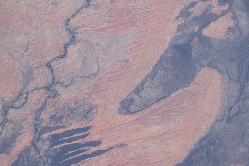 A portion the Innamincka Regional Reserve, surrounded by the Strzlecki Desert, is seen in the northeast part of the South Australia.
