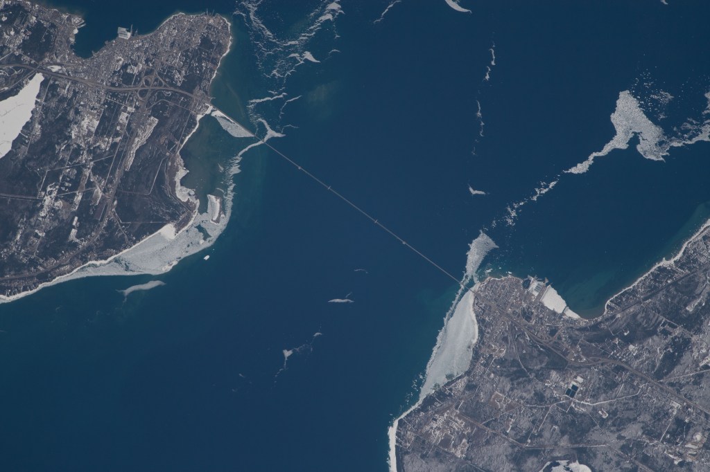 An Expedition 55 crew member photographed the Mackinac Bridge which connects the upper and lower peninsulas of the state of Michigan across an area of water separating Lake Michigan and Lake Huron.