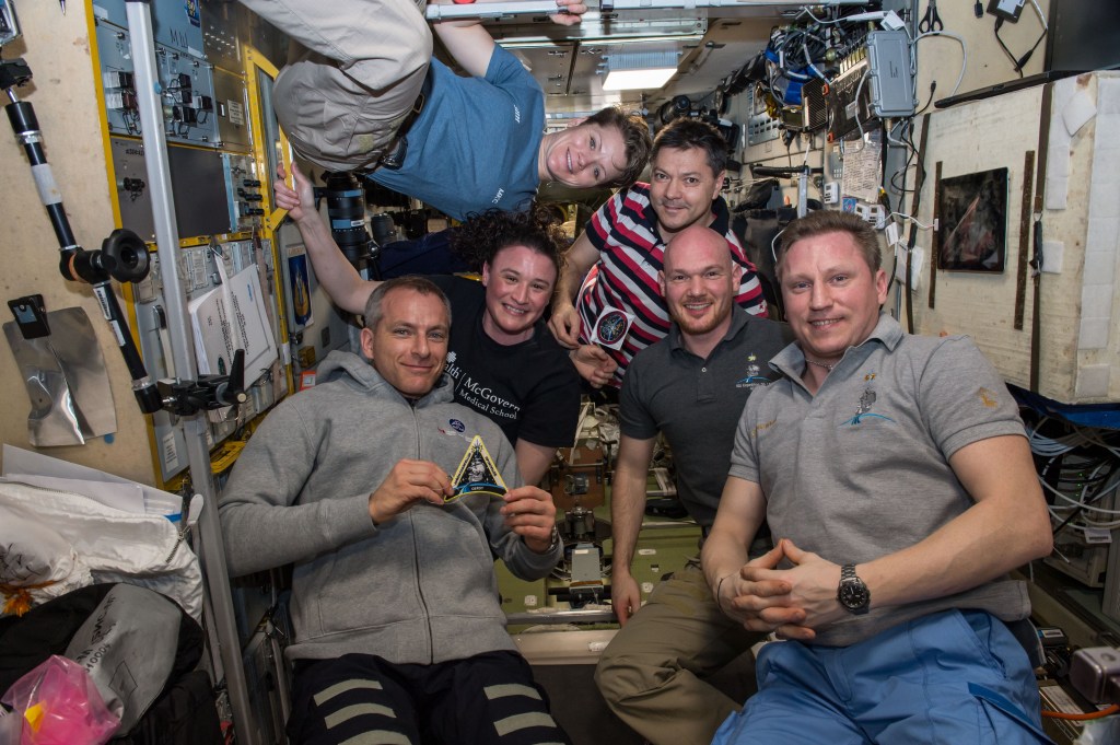 The newly-expanded six-member Expedition 57 crew poses for a portrait inside the International Space Station's Zvezda service module. (Bottom row from left) David Saint-Jacques of the Canadian Space Agency; Serena Auñón-Chancellor of NASA; Expedition 57 commander Alexander Gerst of ESA (European Space Agency); and cosmonaut Sergey Prokopyev of Roscosmos. (Top row from left) NASA astronaut Anne McClain and Roscosmos cosmonaut Oleg Kononenko.