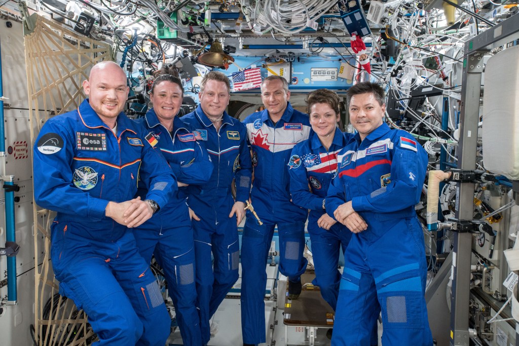 Expedition 56-57 crew members (from left) Alexander Gerst of the ESA (European Space Agency), Serena Auñón-Chancellor of NASA and Sergey Prokopyev from Roscosmos; with Expedition 57-58 crew members David Saint-Jacques of the Canadian Space Agency (CSA), Anne McClain of NASA and Oleg Kononenko from Roscosmos.