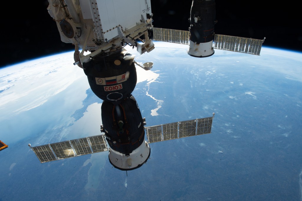 Two Russian spacecraft, the Soyuz MS-09 crew ship (foreground) and the Progress 70 resupply ship, are pictured docked to the International Space Station as the orbital complex orbited nearly 257 miles above Ukraine.