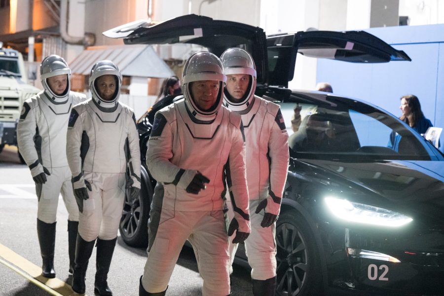 Roscosmos cosmonaut Alexander Grebenkin, and NASA astronauts Jeanette Epps, Matthew Dominick, and Michael Barratt, wearing SpaceX spacesuits, are seen as they prepare to depart the Neil A. Armstrong Operations and Checkout Building for Launch Complex 39A.