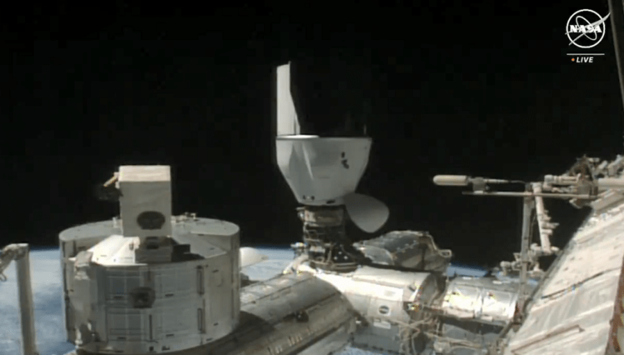 The SpaceX Dragon cargo spacecraft docks to the International Space Station's Harmony module at 7:19 a.m. EDT Saturday, March 23. Credit: NASA TV