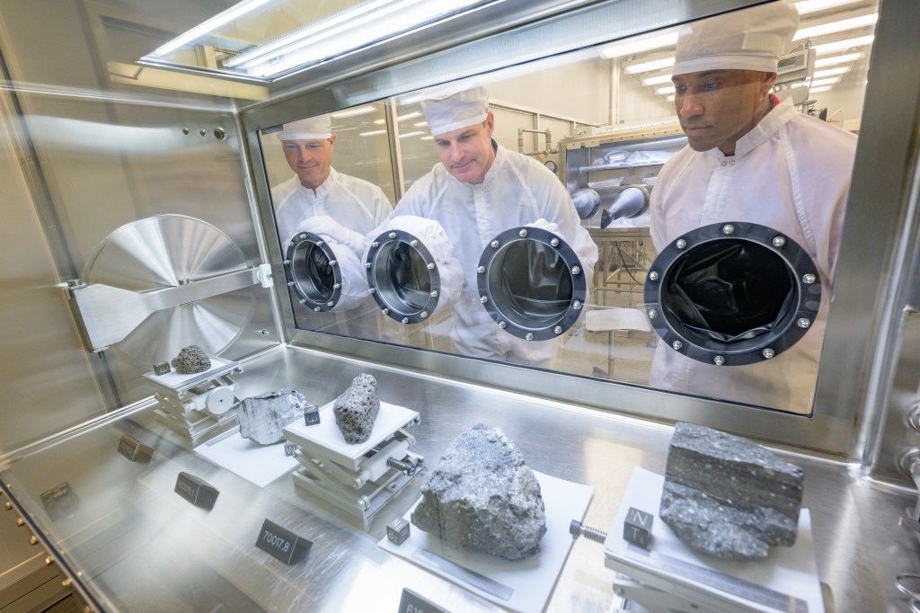 (From left) Artemis II commander Reid Wiseman, mission specialist Jeremy Hansen, and Pilot Victor Glover learn about lunar fundamentals and the historic Apollo moon rocks in the Lunar Lab at NASA’s Johnson Space Center. Credit: NASA/Robert Markowitz 