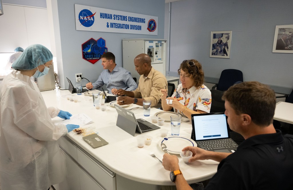 Artemis II crew members (from left) Jeremy Hansen, Victor Glover, Christina Koch, and Reid Wiseman during their first food testing. The crew tastes various space foods that can be brought with them on their future mission to lunar orbit. Credit: NASA/James Blair 