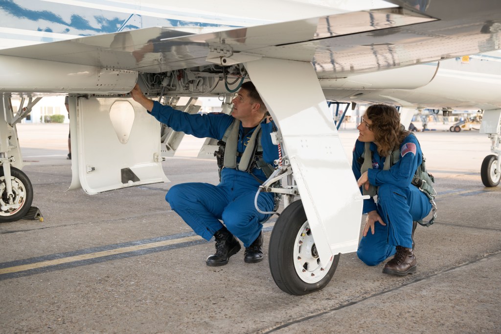 Artemis II mission specialists Jeremy Hansen and Christina Koch prepare their T-38 jet for training at Ellington Field in Houston, Texas. Credit: NASA/Robert Markowitz 