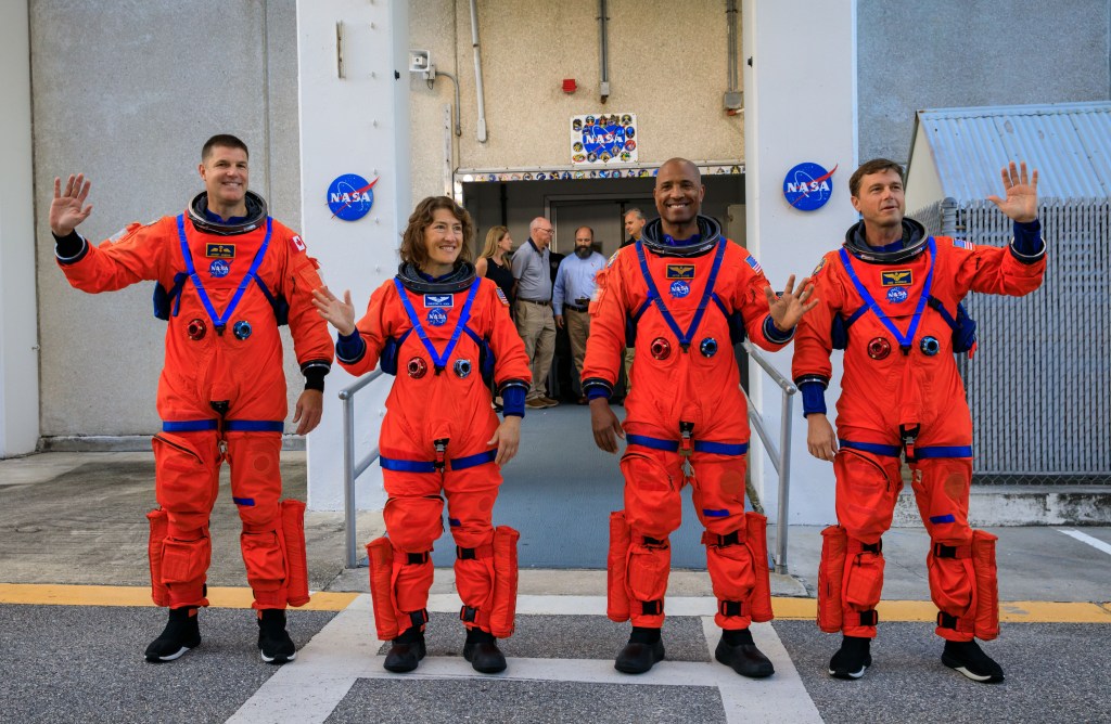 Artemis II crew members (from left) Jeremy Hansen, Christina Koch, Victor Glover, and Reid Wiseman walk out of Astronaut Crew Quarters inside the Neil Armstrong Operations and Checkout Building prior to traveling to Launch Pad 39B as part of an integrated ground systems test at Kennedy Space Center in Florida. Credit: NASA/Kim Shiflett 