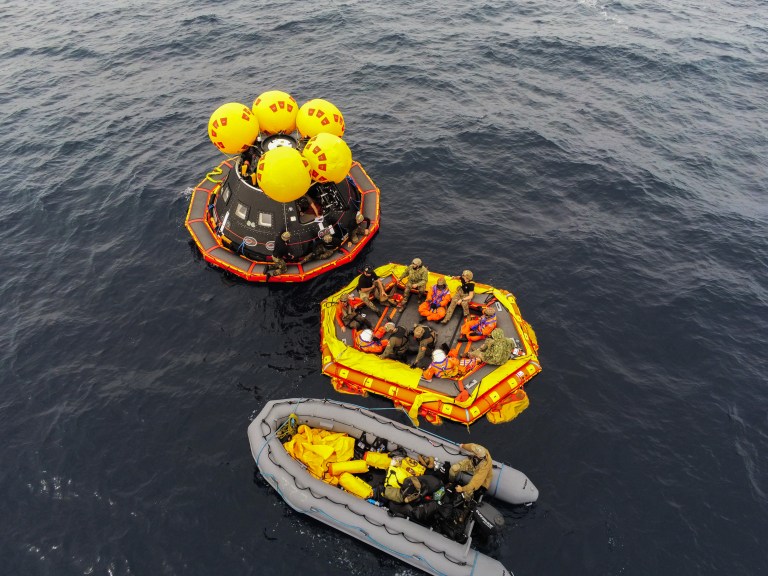 NASA’s Artemis II crew members are assisted by U.S. Navy personnel as they exit a mockup of the Orion spacecraft onto an inflatable “front porch” while NASA’s Exploration Ground System’s Landing and Recovery team and partners from the Department of Defense aboard the USS San Diego practice recovery procedures using the Crew Module Test Article, during Underway Recovery Test 11 (URT-11) off the coast of San Diego, California on Sunday, Feb. 25, 2024. Credit: NASA/Jamie Peer