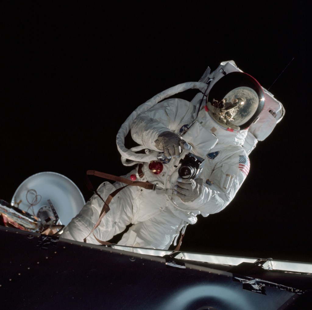 Apollo 9 astronaut Russell L. Schweickart on Spider’s front porch during the mission’s dual spacewalk – note fellow astronaut David R. Scott reflected in Schweickart’s visor