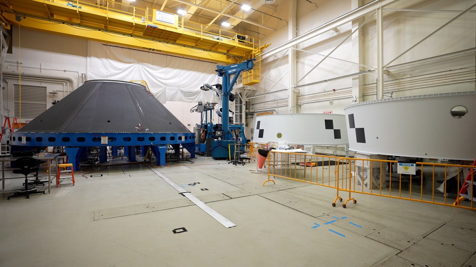 Key adapters for the first crewed Artemis missions are manufactured at NASA's Marshall Space Flight Center in Huntsville, Alabama. The cone-shaped payload adapter, left, will debut on the Block 1B configuration of the SLS rocket beginning with Artemis IV, while the Orion stage adapters, right, will be used for Artemis II and Artemis III.