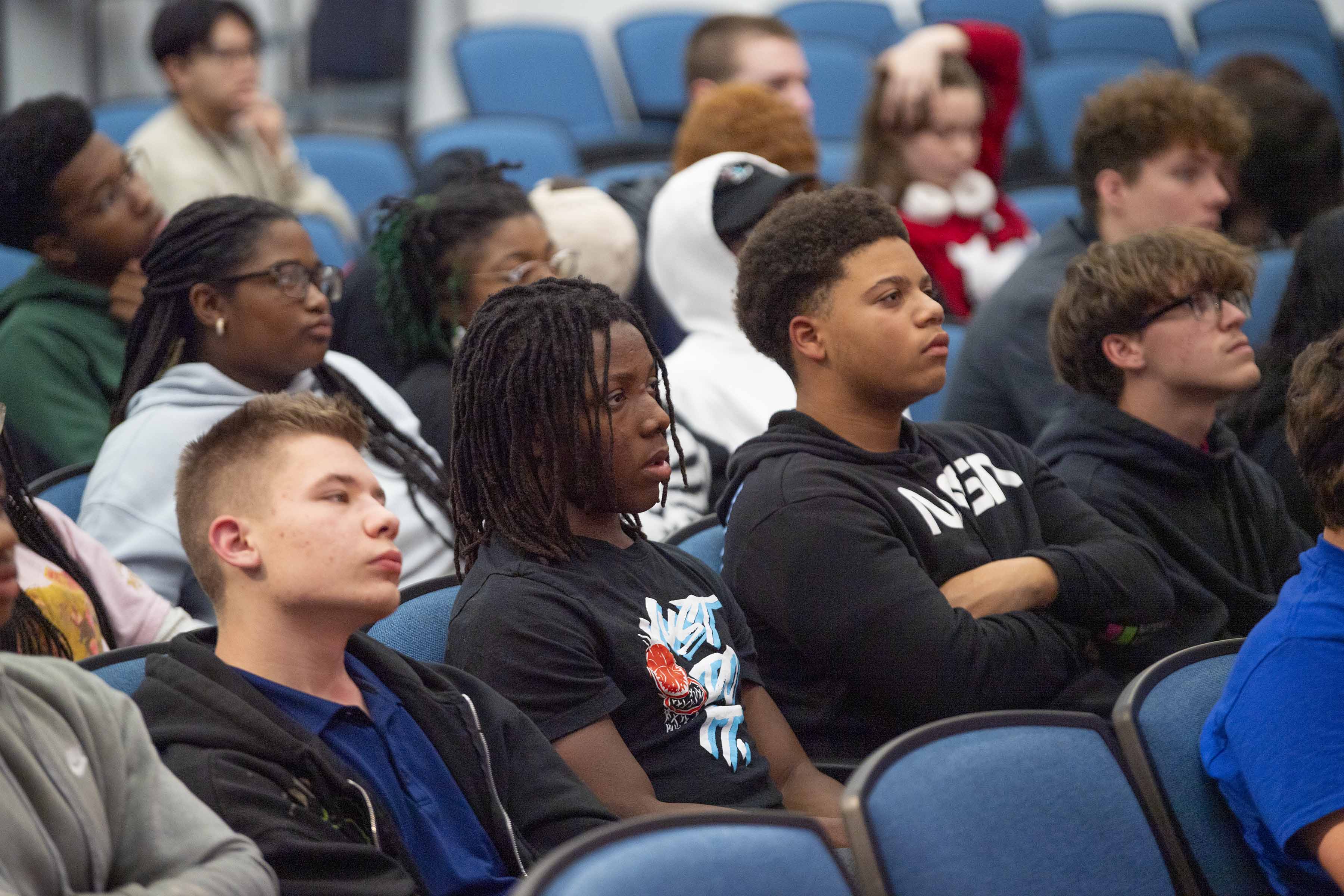 high school students sit in audience as they listen to guest panelists during a Next Gen STEM Explore Stennis event