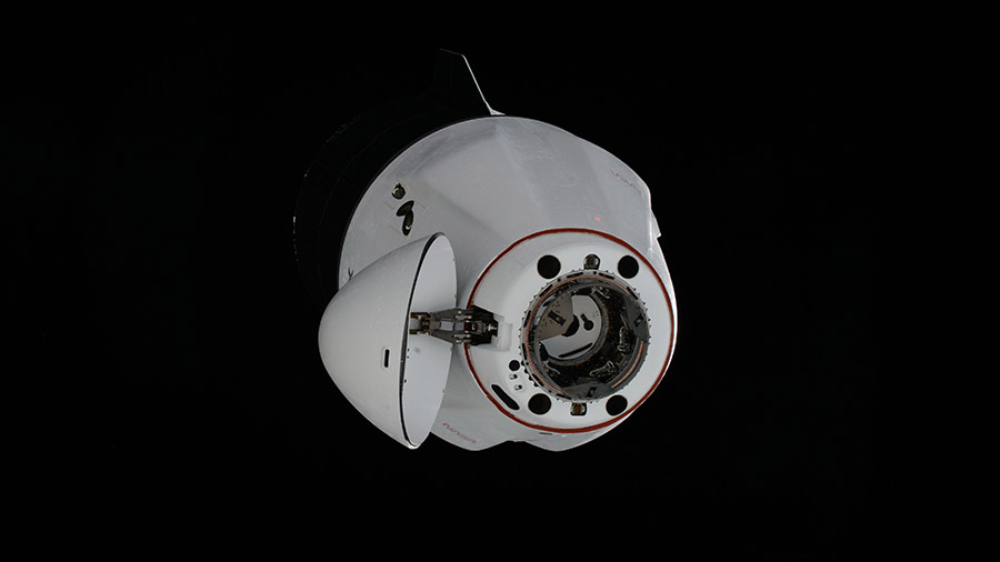 The SpaceX Dragon cargo spacecraft approaches the space station for a docking to the Harmony module's space-facing port on March 23, 2024.