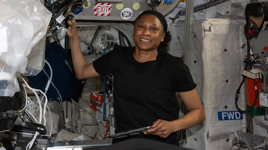 Astronaut Jeanette Epps smiles for a portrait after she finished conducting a HAM radio session with Italian students.