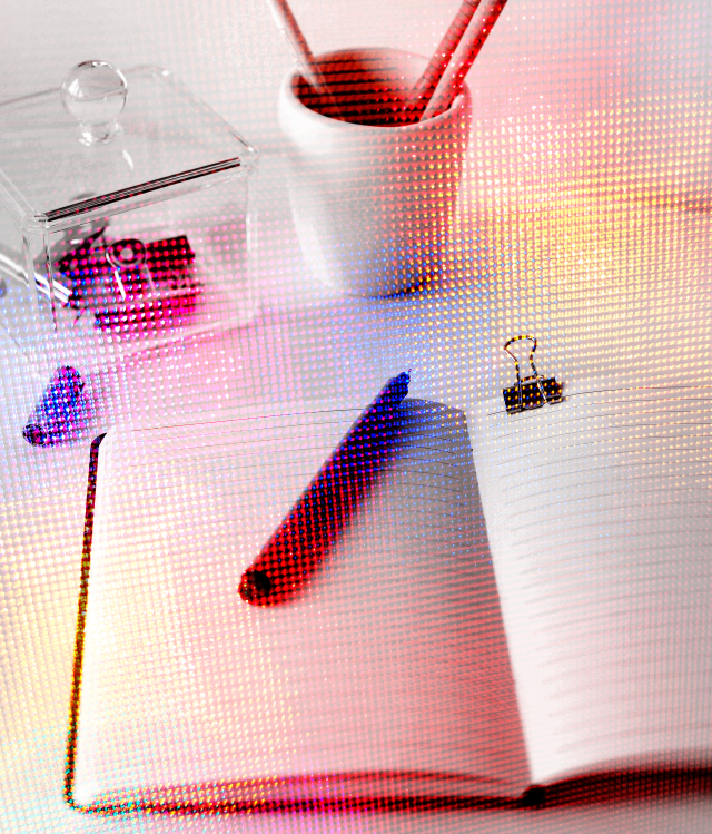 Image of a notebook and pen on a desk with a colorful digital overlay