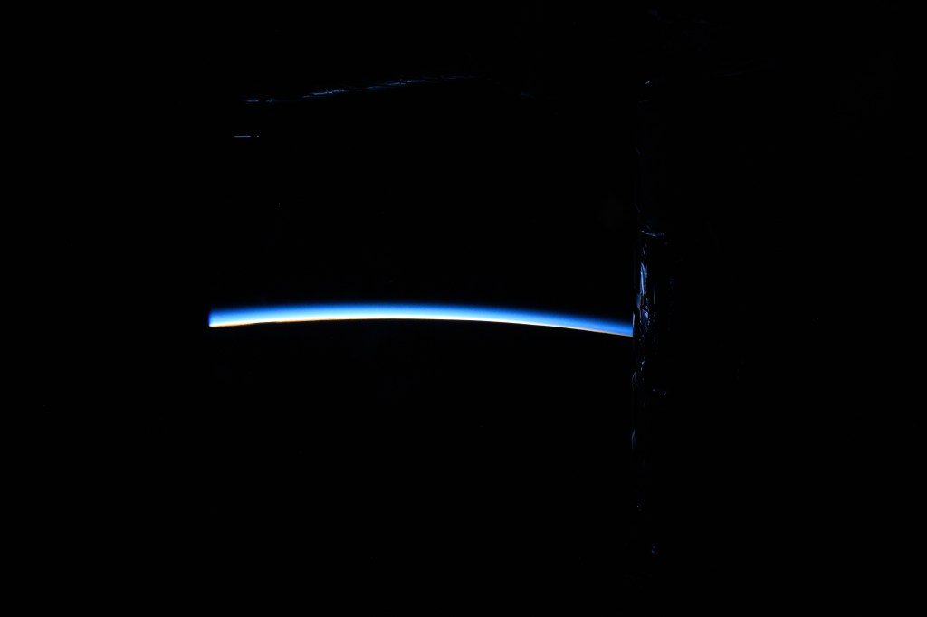iss071e000922 (April 6, 2024) -- The first moments of an orbital sunrise crown Earth's horizon as the International Space Station soared 268 miles above the Pacific Ocean. Astronauts aboard the orbiting laboratory experience 16 sunrises and sunsets per day.