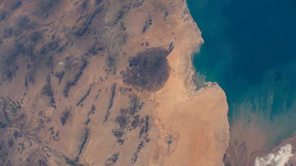 The Pinacate Peaks (at center), a group of volcanic peaks in the Mexican state of Sonora just north of the Gulf of California, are pictured from the International Space Station as it orbited 258 miles above.