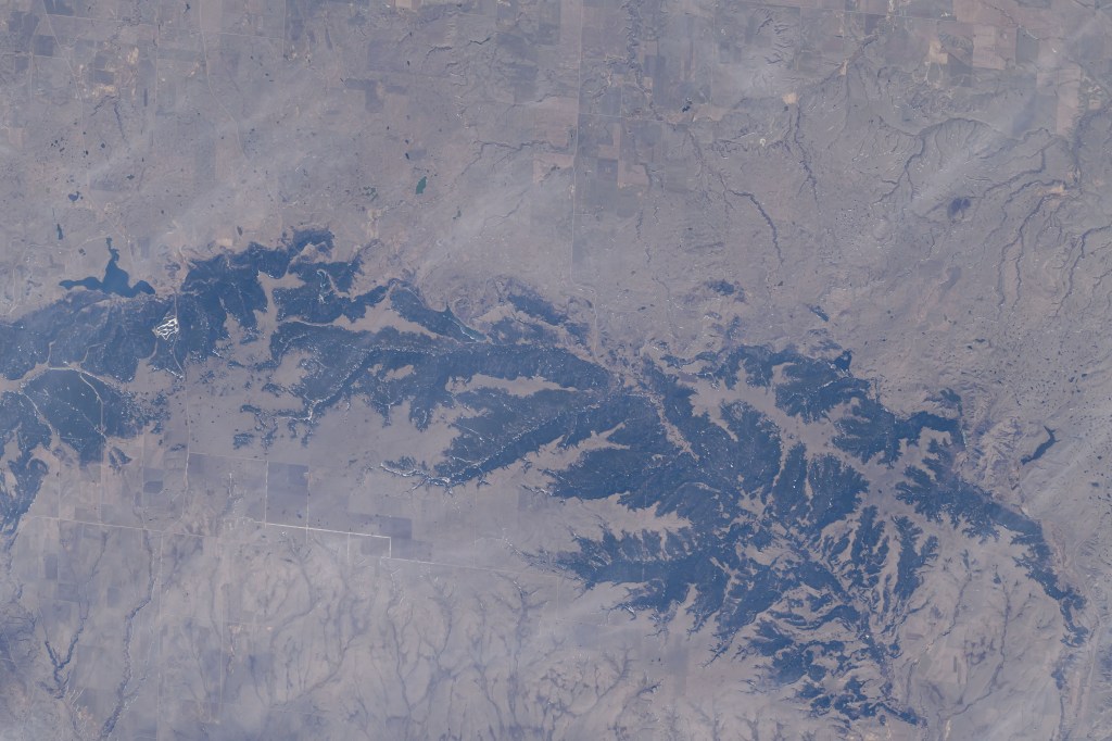 The Cypress Hills extend from the Canadian provinces of Alberta and Saskatchewan in this photograph from the International Space Station as it orbited 260 miles above North America.
