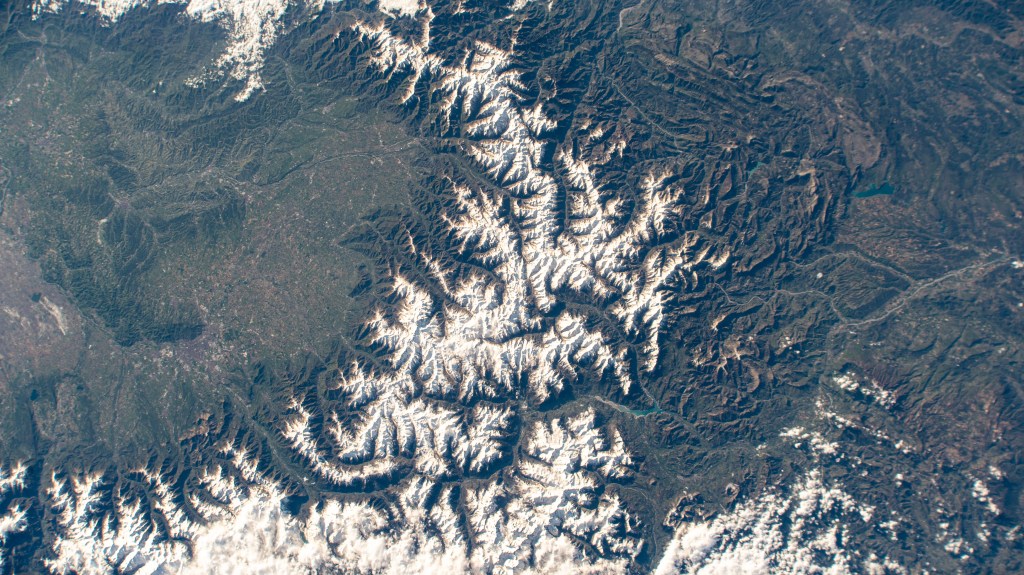 Turin, Italy, and its suburbs (at left) lie at the southwestern foot of the Alps in this photograph from the International Space Station as it orbited 260 miles above Europe.