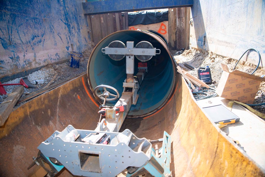 image features the special tool used to place a new pipeline liner section for the upgrade to the water system