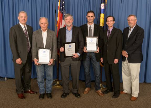 NASA ARC Chief Counsel member Thomas W. Berndt, NASA ARC Chief Patent Counsel Robert Padilla, and ARC Acting Deputy Center Director Dr. Charles A. Smith present Charles Bryson, David Blake, and Philippe Sarrazin