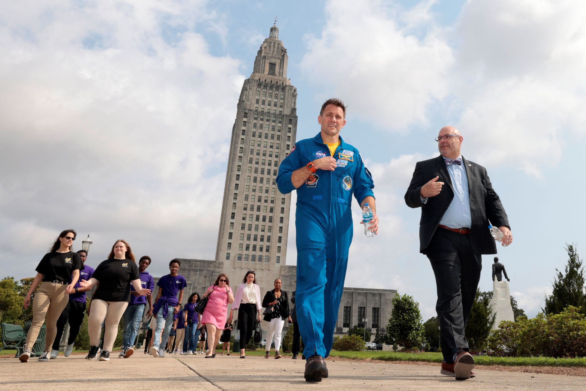 NASA astronaut Josh Cassada and NASA Marshall Space Flight Center Director Joseph Pelfrey lead students from area schools across the Louisiana State Capitol grounds to attend a series of panel discussions as part of Louisiana Space Day 2024.