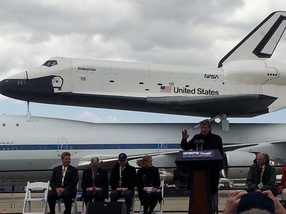 Star Trek cast member Leonard Nimoy gives the Vulcan greeting in front of space shuttle Enterprise after its arrival in New York in 2012