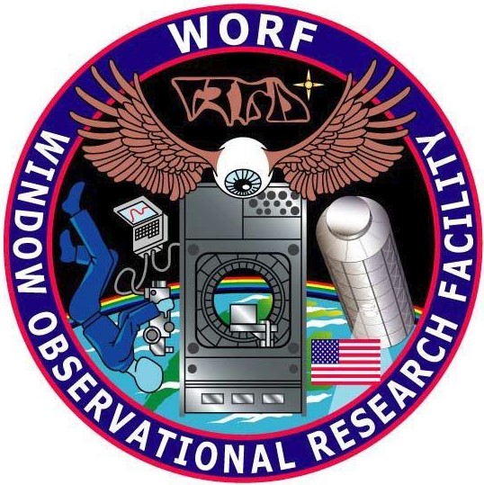 Patch for the Window Observational Research Facility (WORF), including the Klingon writing just below the letters “WORF.”
