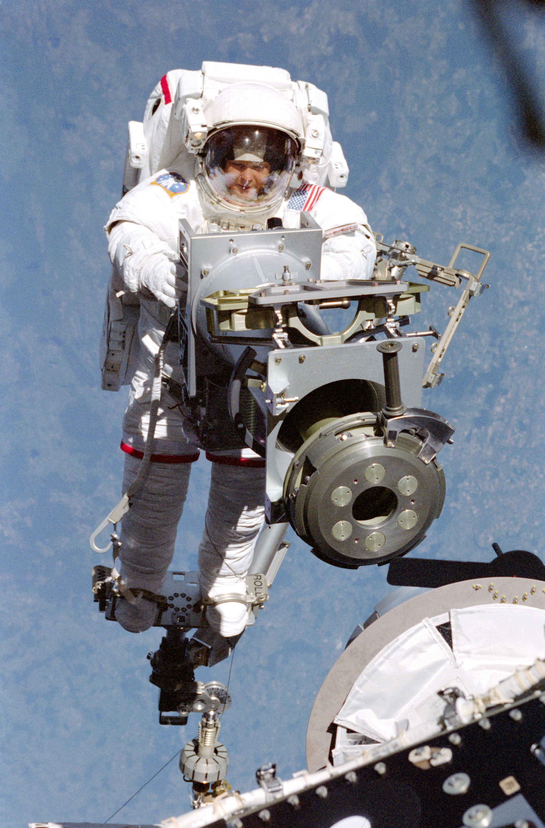 Tamara E. Jernigan carries the Strela boom to the Zarya module.