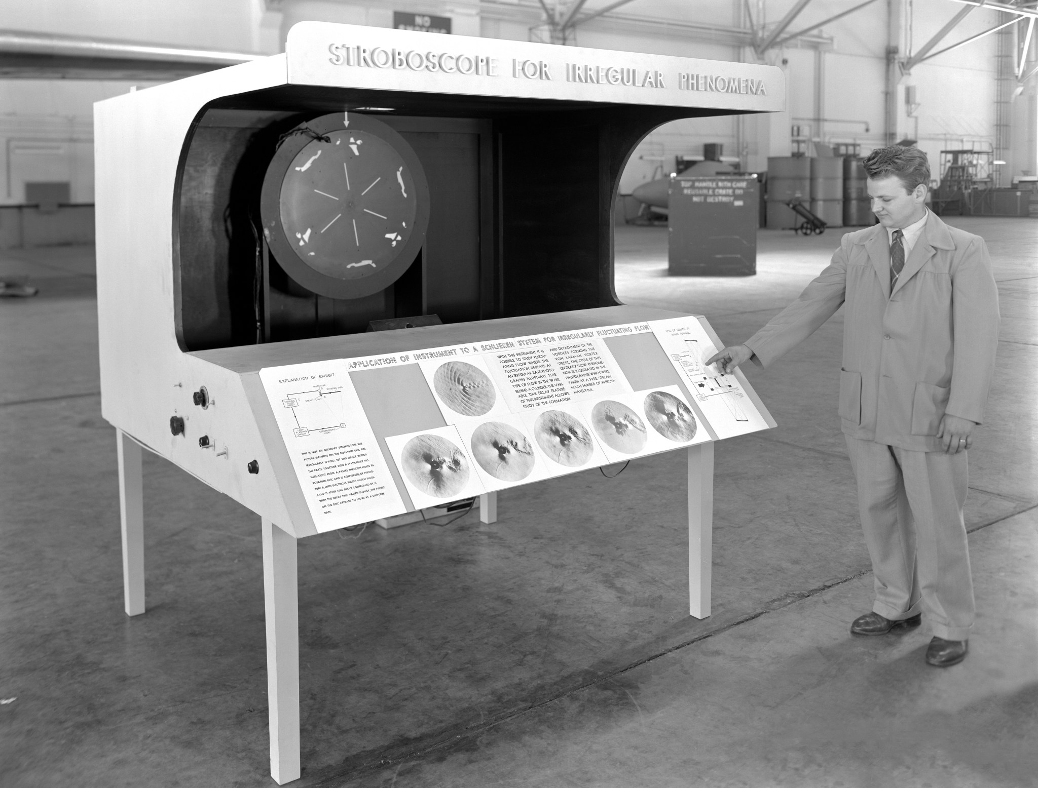 Man standing with exhibit.