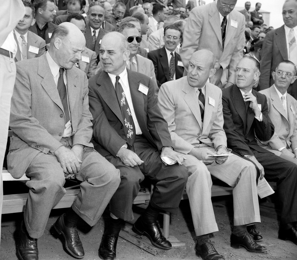 Group of men seated.