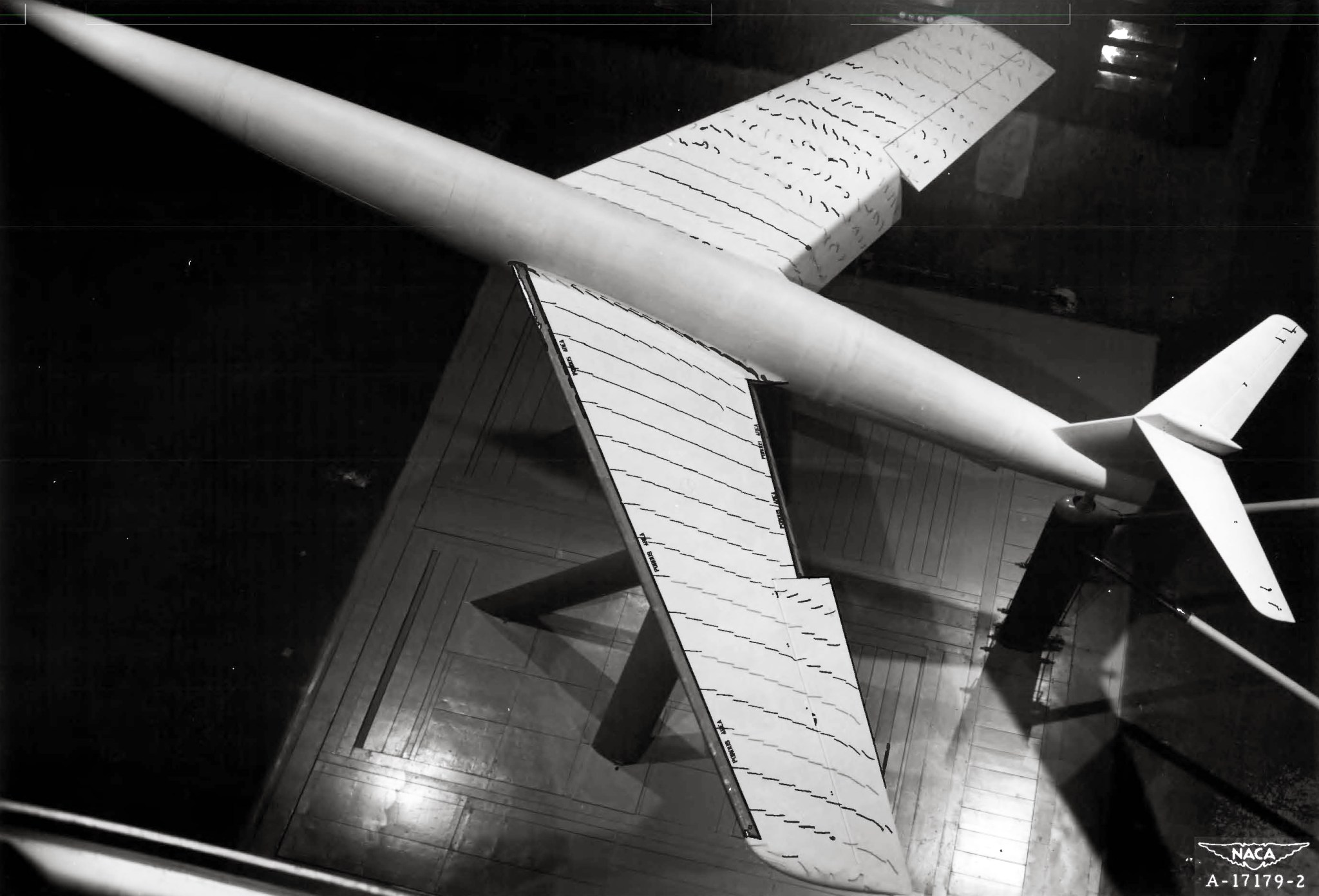 Model aircraft in wind tunnel.