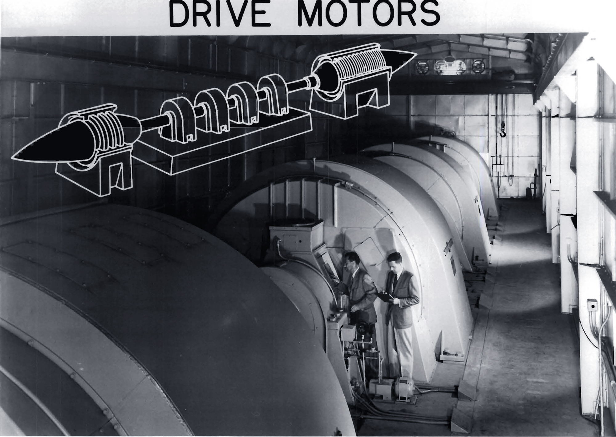 Two men with large drive motor.